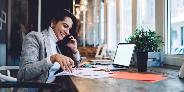 An image of a woman calling a client for big money at home unlike the wagies at the work offices lol